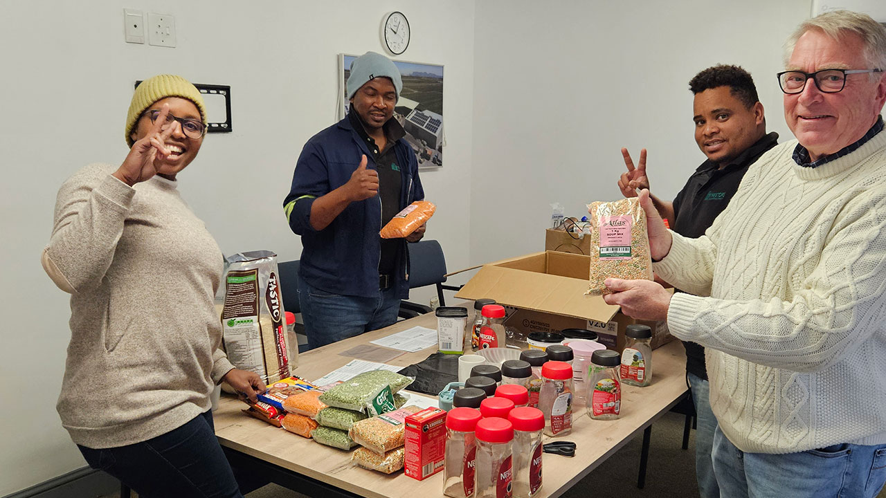 Treetops staff packaging food parcels